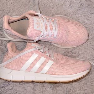 Light pink adidas running shoes